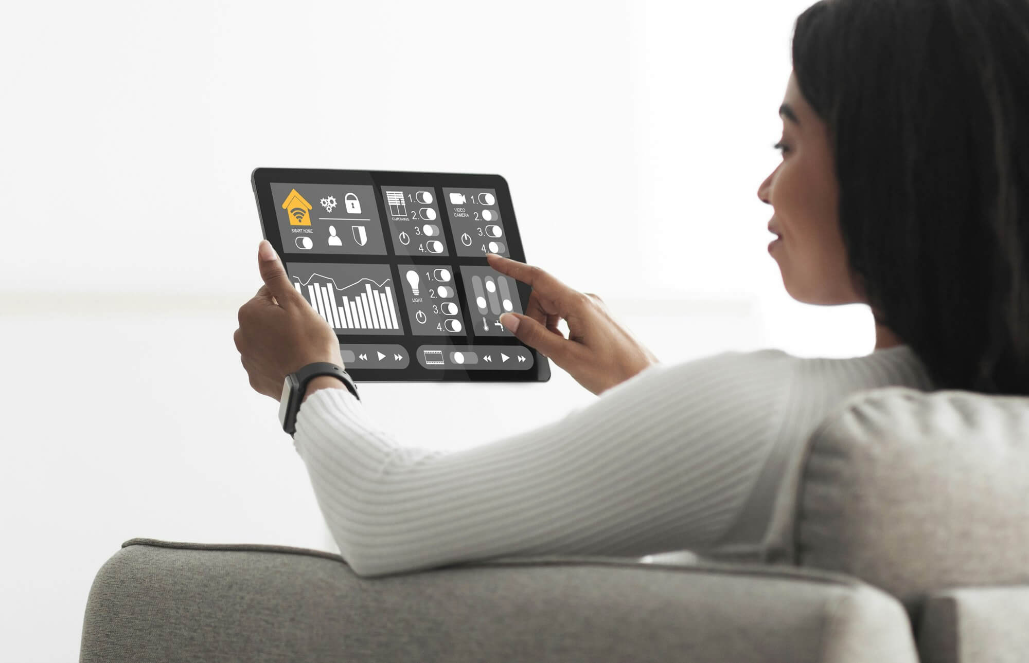 african-american-woman-using-smart-home-automation-assistant.jpg